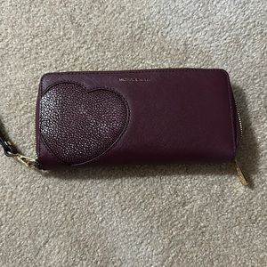 Michael Kors zip around wallet in Dark purple.
